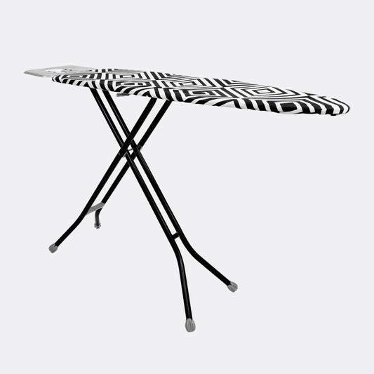 Black and white patterned ironing board on a stand against a white background